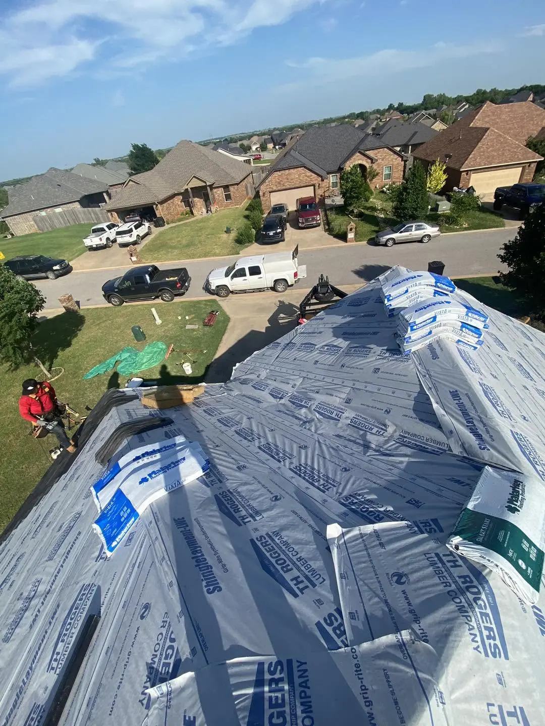 Underlayment installed across a residential roof during active roofing work